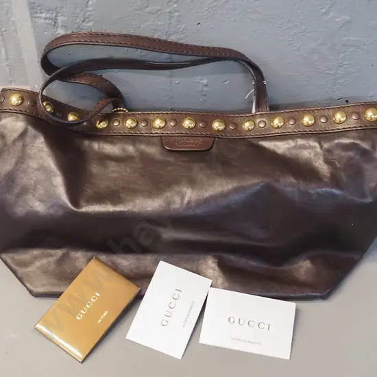 Gucci brown leather tote bag, with brass studs, made in Italy. H270 W460.  Date code 207291-493075