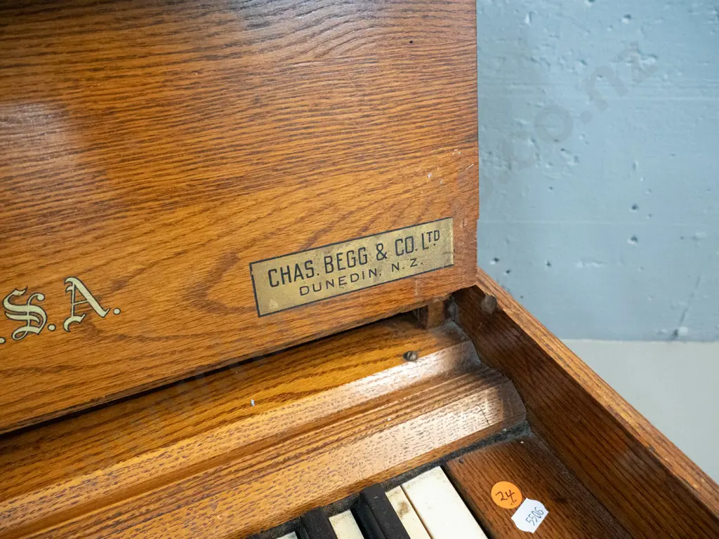 vintage oak-cased portable organ - Estry Organ Company, Brattleboro VT & Begg & Co Dunedin retail label, leather handles Image 1++