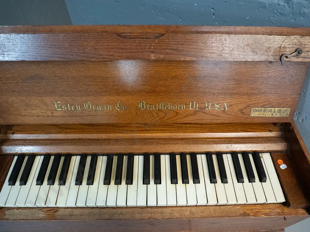 vintage oak-cased portable organ - Estry Organ Company, Brattleboro VT & Begg & Co Dunedin retail label, leather handles Image 1++