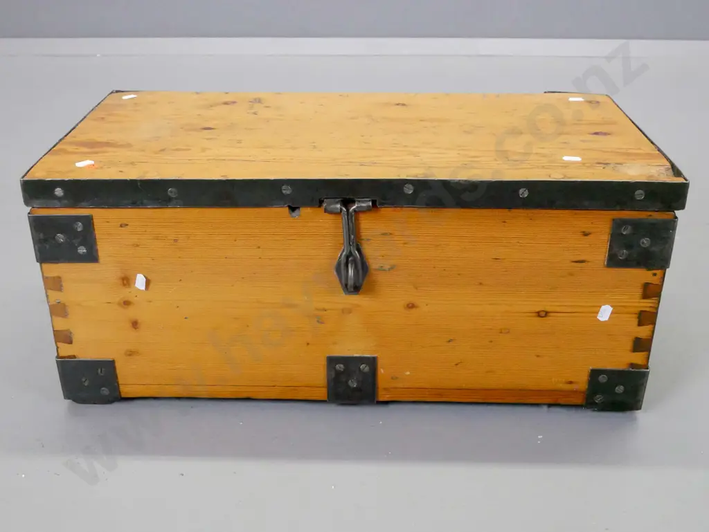 vintage small pine trunk with metal strapping, corner binding and carry handles, has non-functioning padlock. Chip to Image 1++