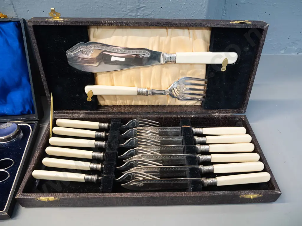 vintage cased set faux bone-handled knives and forks w/servers and a cased plated manicure set with damage to hinge Image 1++