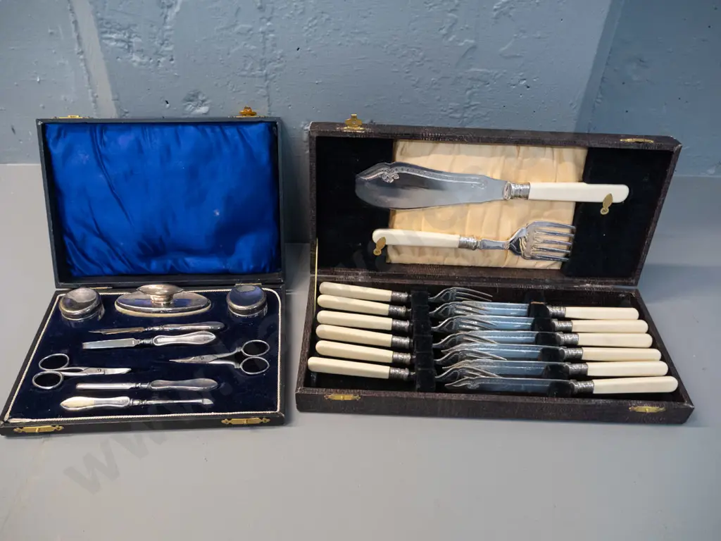 vintage cased set faux bone-handled knives and forks w/servers and a cased plated manicure set with damage to hinge Image 1++