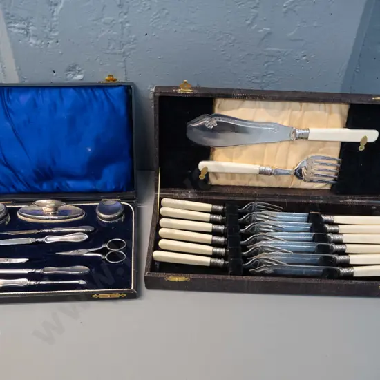 vintage cased set faux bone-handled knives and forks w/servers and a cased plated manicure set with damage to hinge