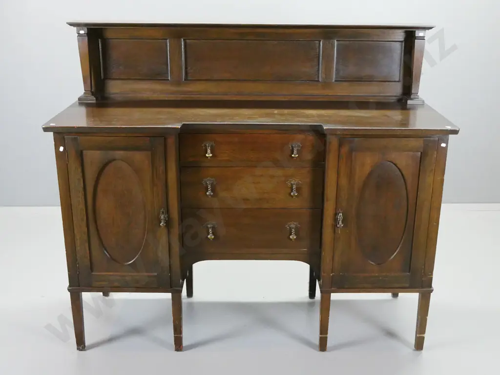 oak arts & crafts sideboard with panelled back with square tapered columns, inverted break front, 2 cupboard doors and 3 Image 1++
