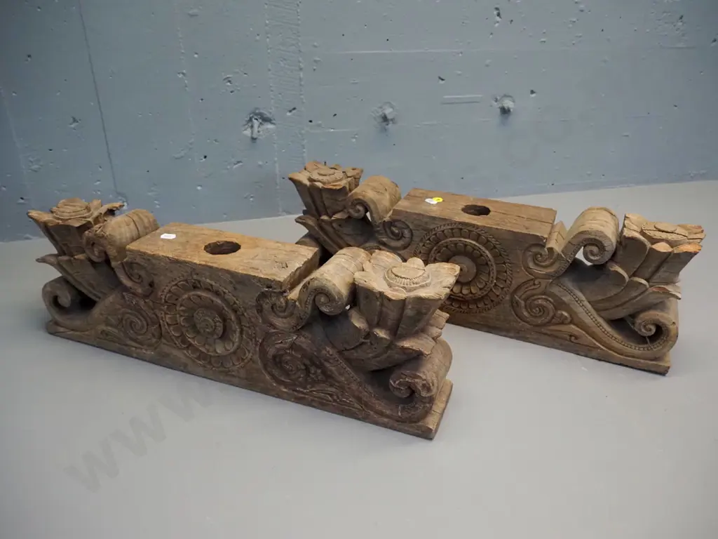 pair of hand-carved teak lintels with foliate & scrolling decoration, both large holes drilled through centre, chips to Image 1++
