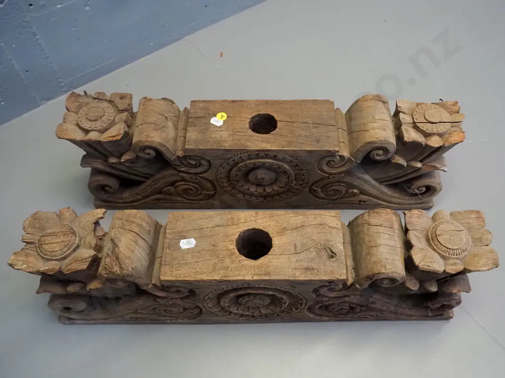 pair of hand-carved teak lintels with foliate & scrolling decoration, both large holes drilled through centre, chips to Image 1++