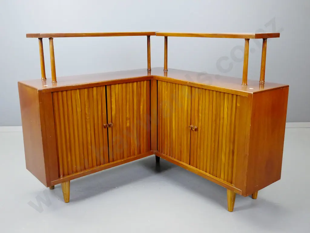retro mahogany corner unit with top shelf on round supports, 4 sliding tambour doors - some staining to polish on top Image 1++