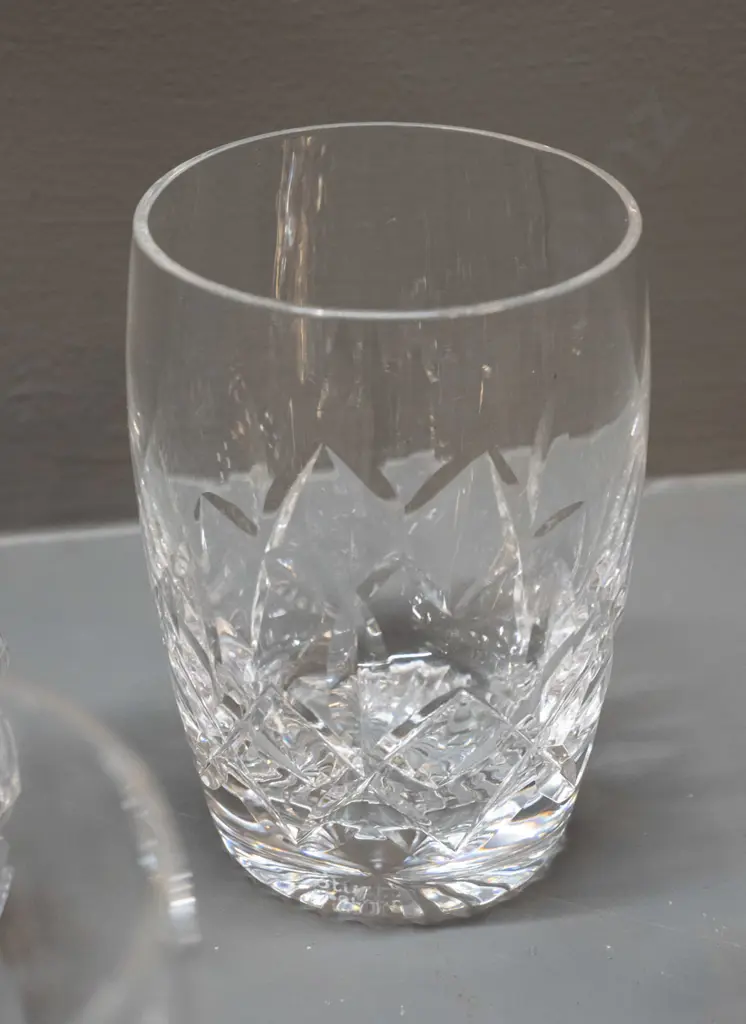 Stuart cut crystal small decanter with 6 glasses and 7 Waterford stemmed sherry or liqueur glasses. Decanter H170 Image 1++