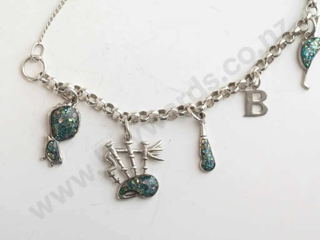 silver charm bracelet with various charms & safety chain stamped 925 Image 1++