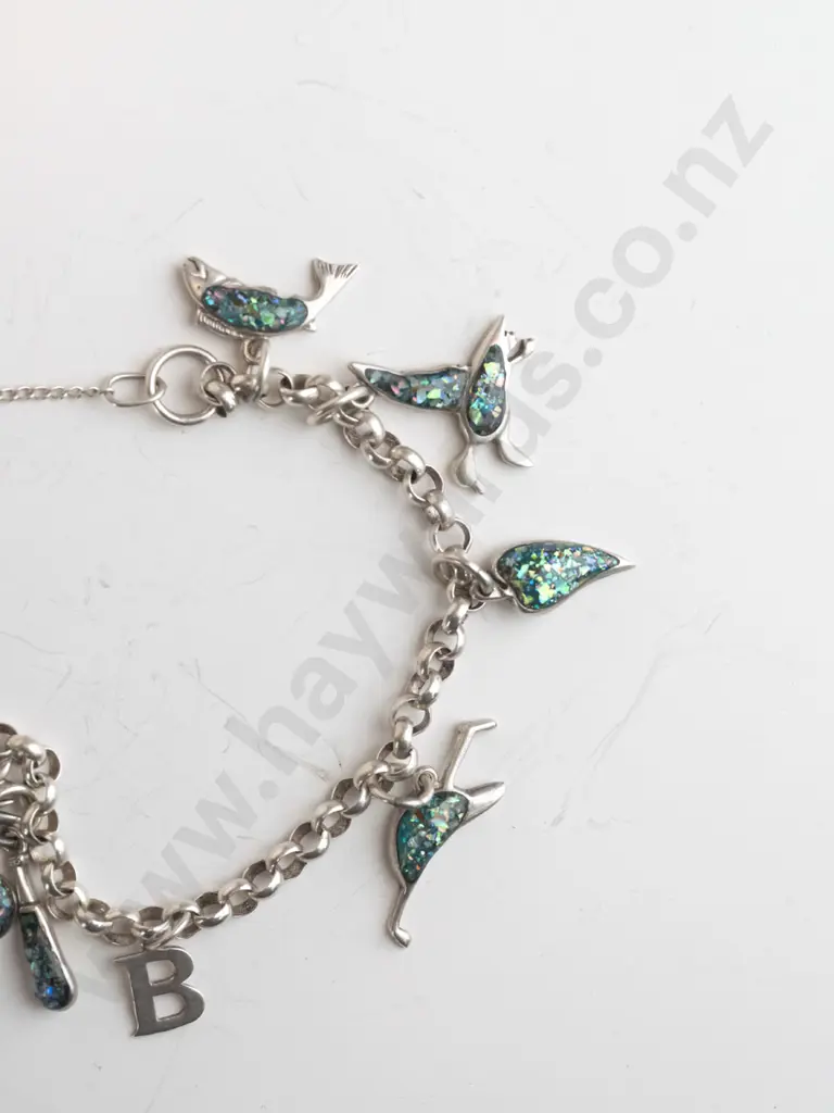 silver charm bracelet with various charms & safety chain stamped 925 Image 1++