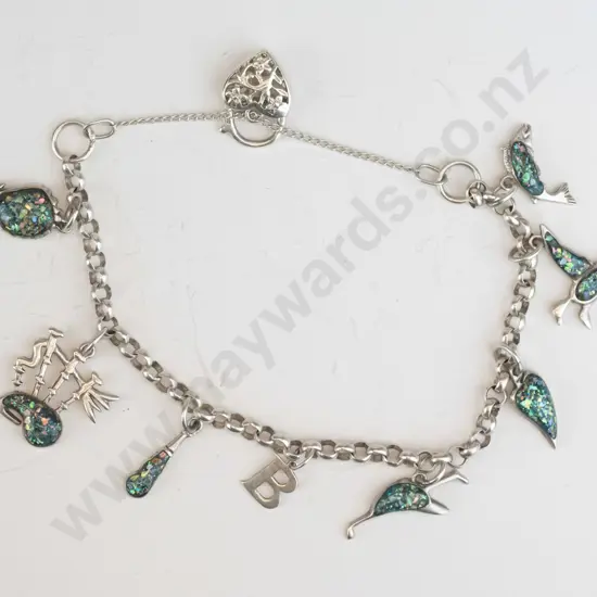 silver charm bracelet with various charms & safety chain stamped 925