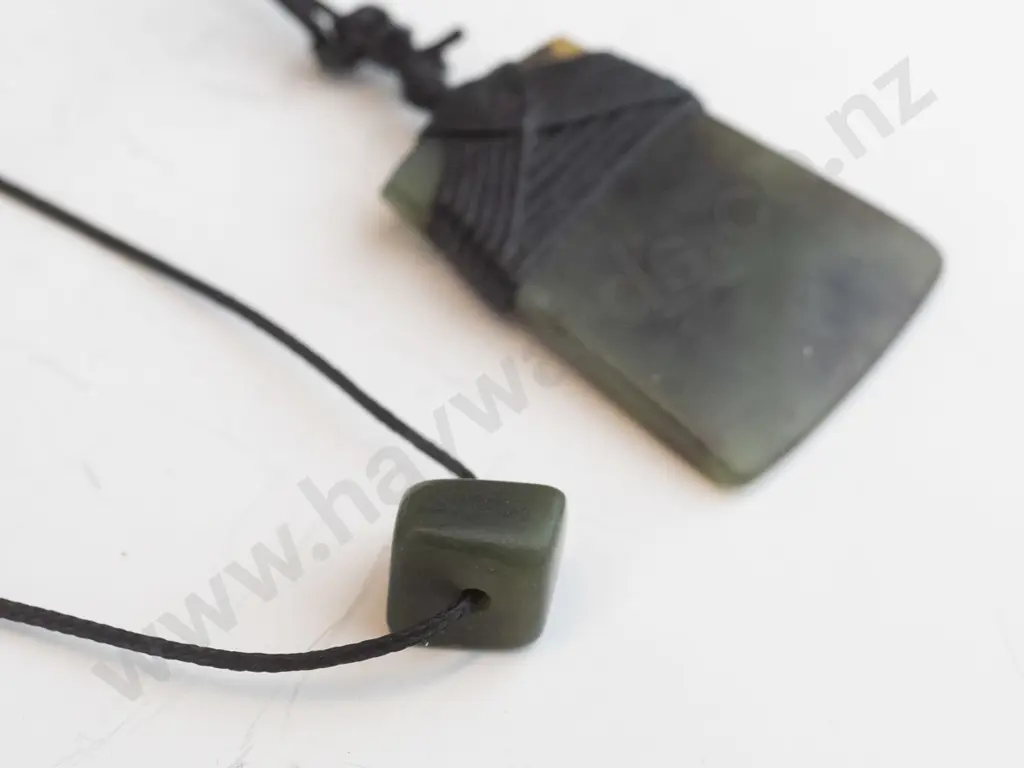 greenstone pendant on leather strand Image 1++