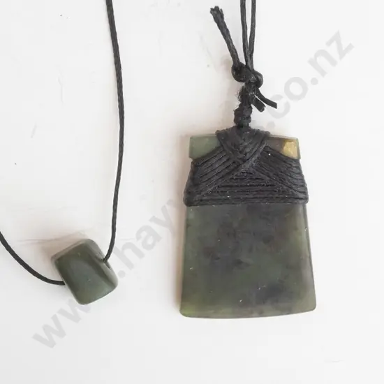 greenstone pendant on leather strand