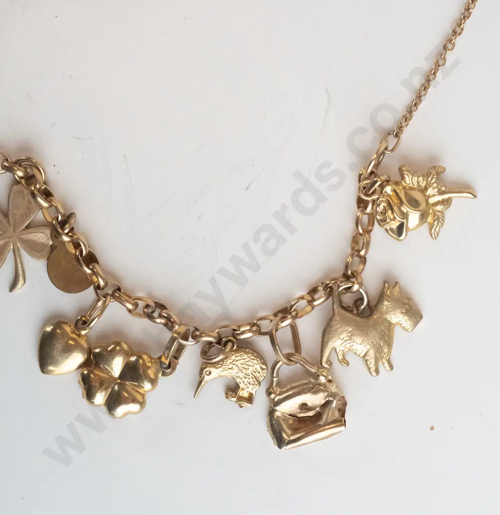 charm bracelet with various charms stamped 375 Image 1++