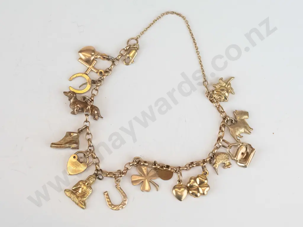 charm bracelet with various charms stamped 375 Image 1++