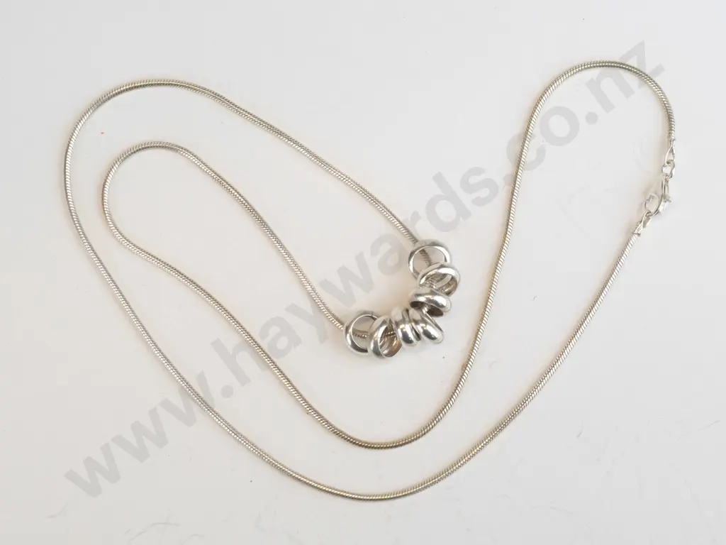 silver necklace with 7 rings stamped 925 Image 1++