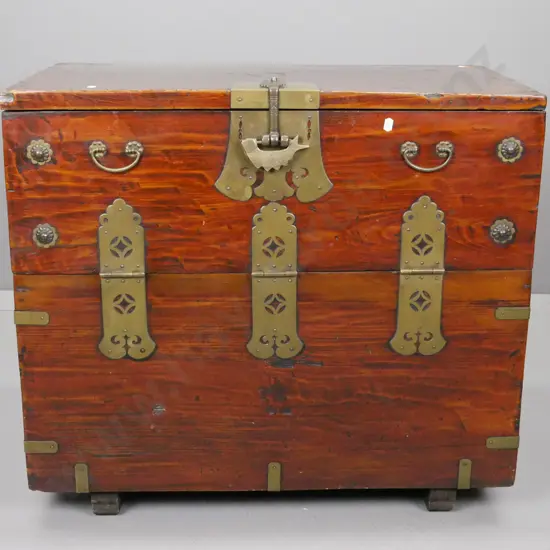 asian drop-front storage chest with 2 internal drawers, brass hinges, strapping, carry handles and fish motif lock,