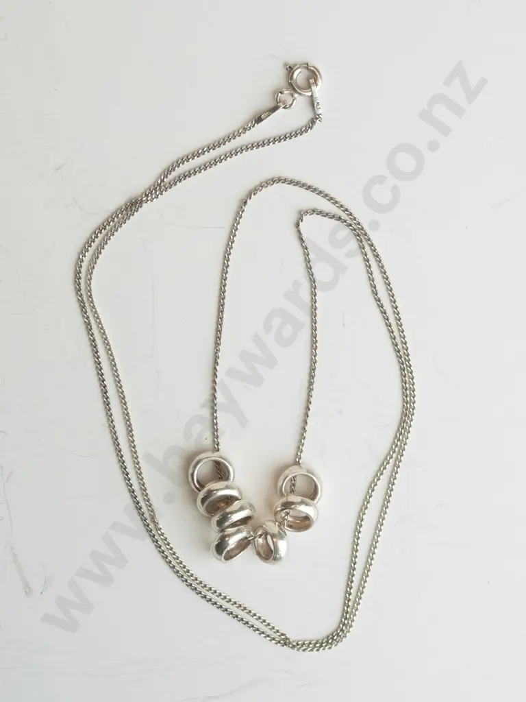 silver necklace with 7 small rings Image 1++