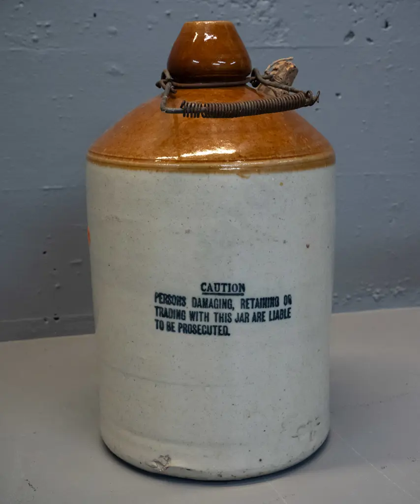 Neilson Vickers & Co Dunedin stoneware narrow-mouth crock with wire handle - hairline crack on front. H-340 D-200 Image 1++