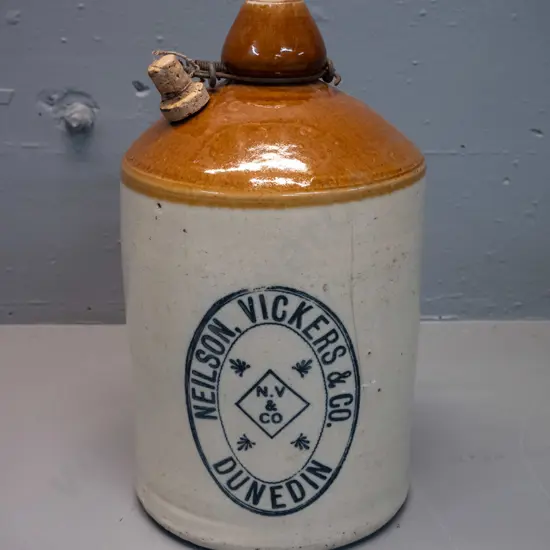 Neilson Vickers & Co Dunedin stoneware narrow-mouth crock with wire handle - hairline crack on front. H-340 D-200