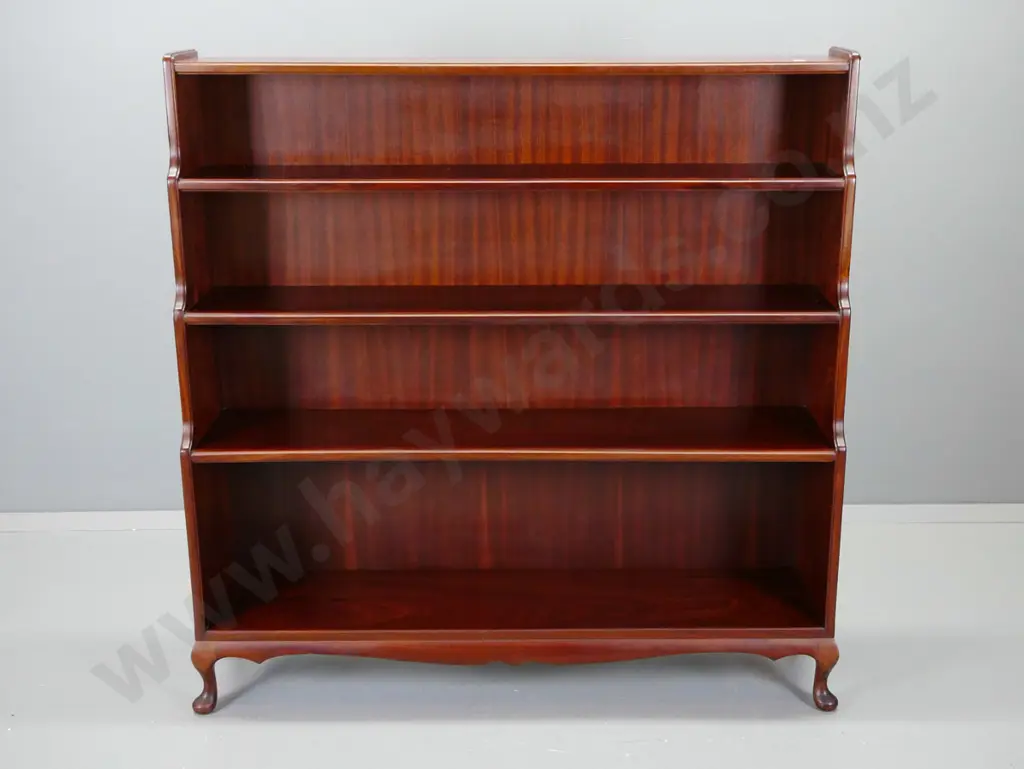 mahogany waterfall front bookcase w/ 5 fixed shelves, shaped skirt on small cab feet H-1250 W-1230 D-300 at base Image 1++