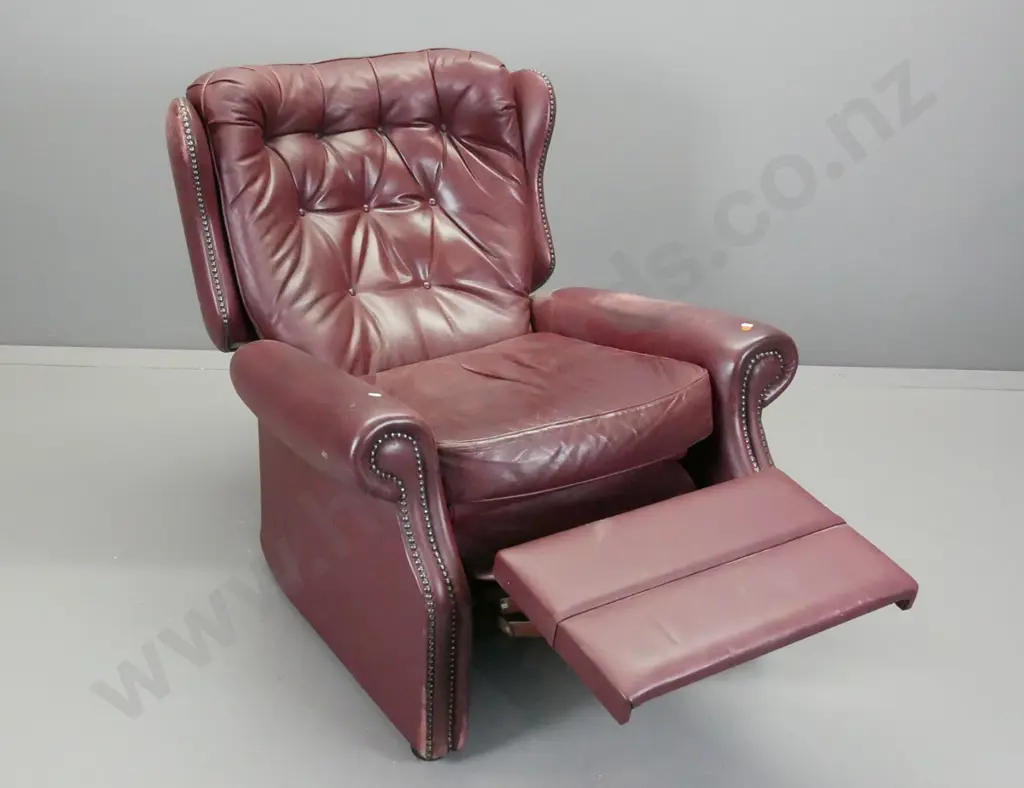 traditional style Astley & Sons NZ button back leather reclining wing chair with studded decoration - wear to finish on Image 1++