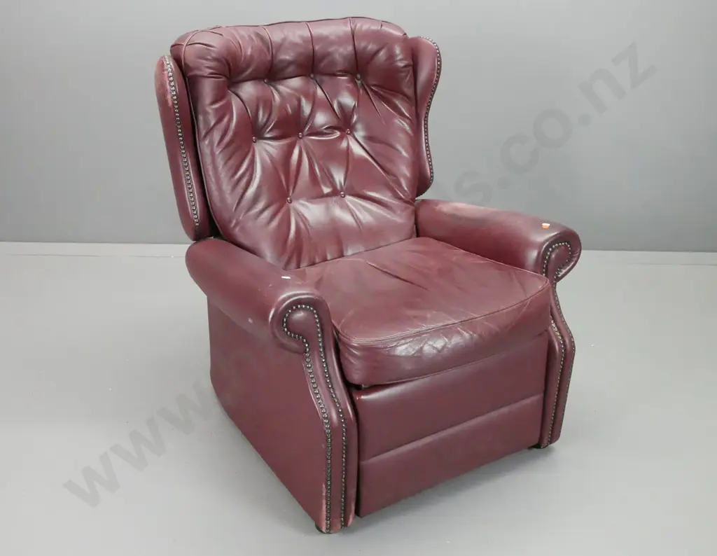 traditional style Astley & Sons NZ button back leather reclining wing chair with studded decoration - wear to finish on Image 1++