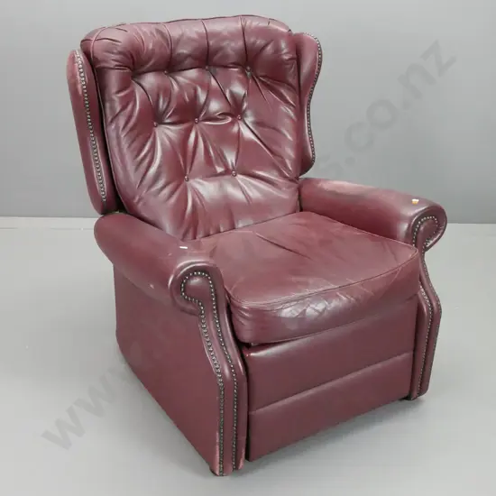 traditional style Astley & Sons NZ button back leather reclining wing chair with studded decoration - wear to finish on