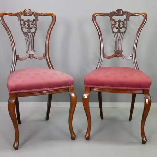 vintage pair walnut dining chairs with pierced slat back, carved shell decoration, cabriolet front legs. Slightly loose