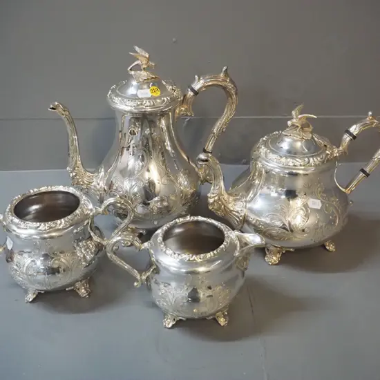 4 piece plated tea and coffee service - teapot, coffee pot, cream & sugar, with applied moulded decoration, bird finial