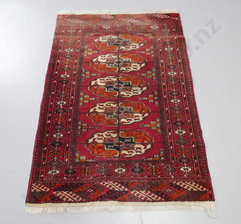 small Persian style hand knotted wool floor rug - fading to one end L-1310 W-890 Image 1++