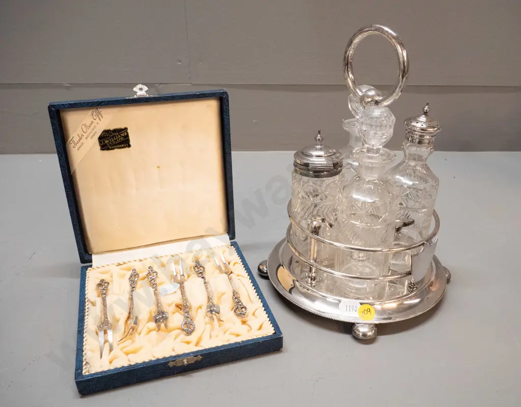 cased set of 6 Norwegian sterling silver pickle forks and an EPNS condiment set with 4 cut glass condiments Image 1++
