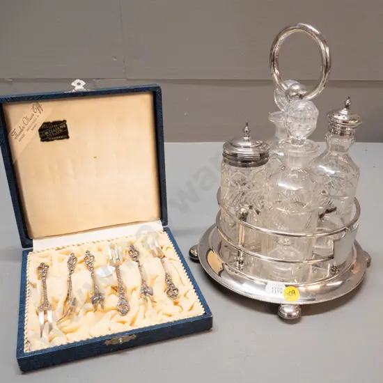 cased set of 6 Norwegian sterling silver pickle forks and an EPNS condiment set with 4 cut glass condiments