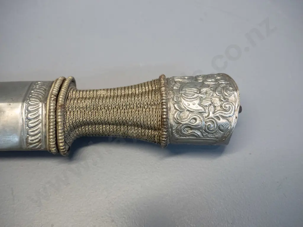knife from Bhutan with hammered and woven metal handle, hammered dragon motif metal over timber sheath L470 Image 1++