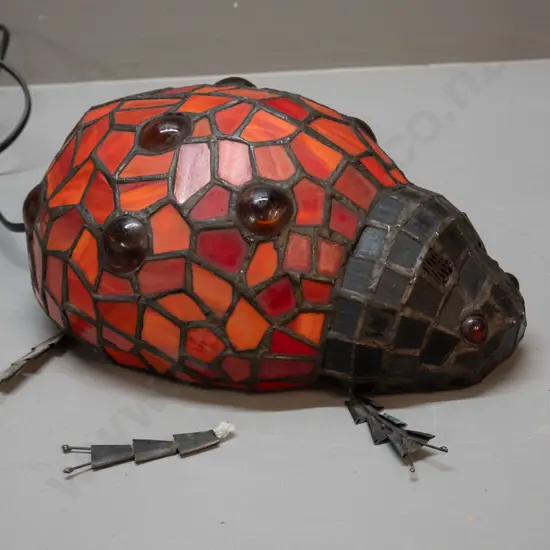 restorer's reproduction Tiffany style ladybird beetle lamp, one foot broken off, others loose, missing antennae L250