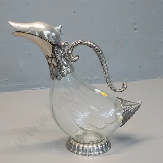 footed claret jug with silver plated hinged bird head top, handle, foot and tail - marked "Silea" on base H-255 L-260