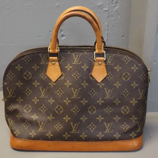 Louis Vuitton monogram Alma bag, made in USA. Some staining to leather H240 W320. Date code 311210.527411