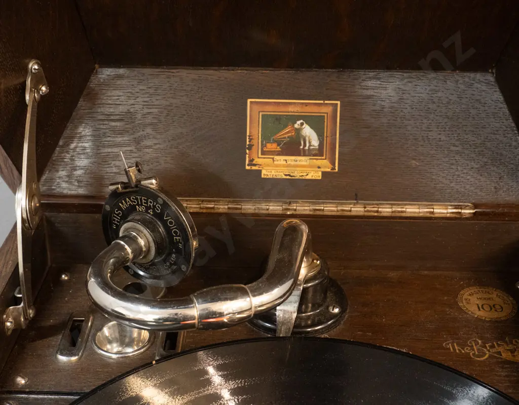 vintage oak-cased His Master's Voice "The Bristol" wind-up gramophone with one record and 3 containers of needles. Going Image 1++