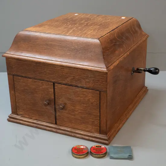 vintage oak-cased His Master's Voice "The Bristol" wind-up gramophone with one record and 3 containers of needles. Going