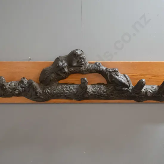 5-hook coat rack with cast metal frog and branch motif hangers on timber back board H-190 W-800