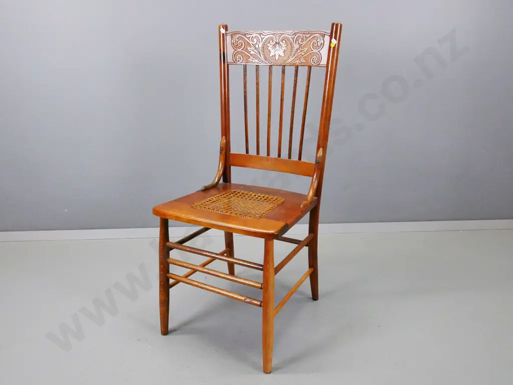 vintage beech pressed back side chair with turned spindle back and stretcher base, cane seat, some scratching to seat Image 1++