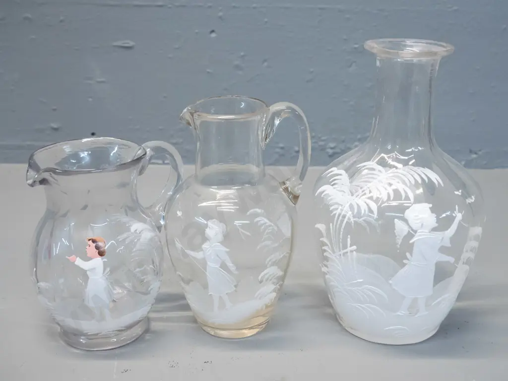 3 pieces of Mary Gregory style decorated clear glass - 2 jugs and a flask/decanter H-180 - fleck to rim of one jug Image 1++