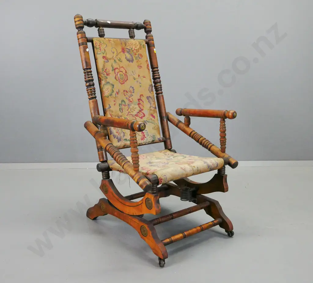 vintage turned beech Dexter rocking chair with brass end caps, metal casters on front legs, borer in rocker Image 1++