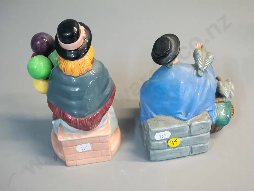 2 Royal Doulton figurines - seated balloon seller H-170 and woman feeding pigeons Image 1++