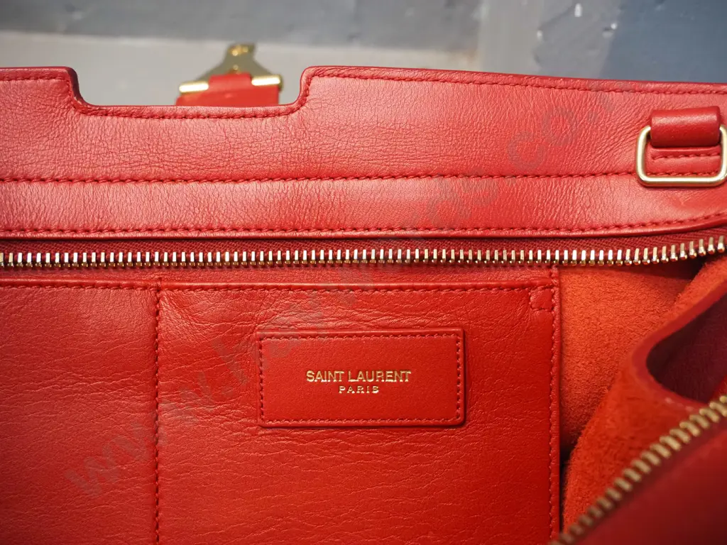 Yves Saint Laurent red leather hand bag with detachable strap - some wear and rubbing H-220 W300. NOT AUTHENTICATED Image 1++