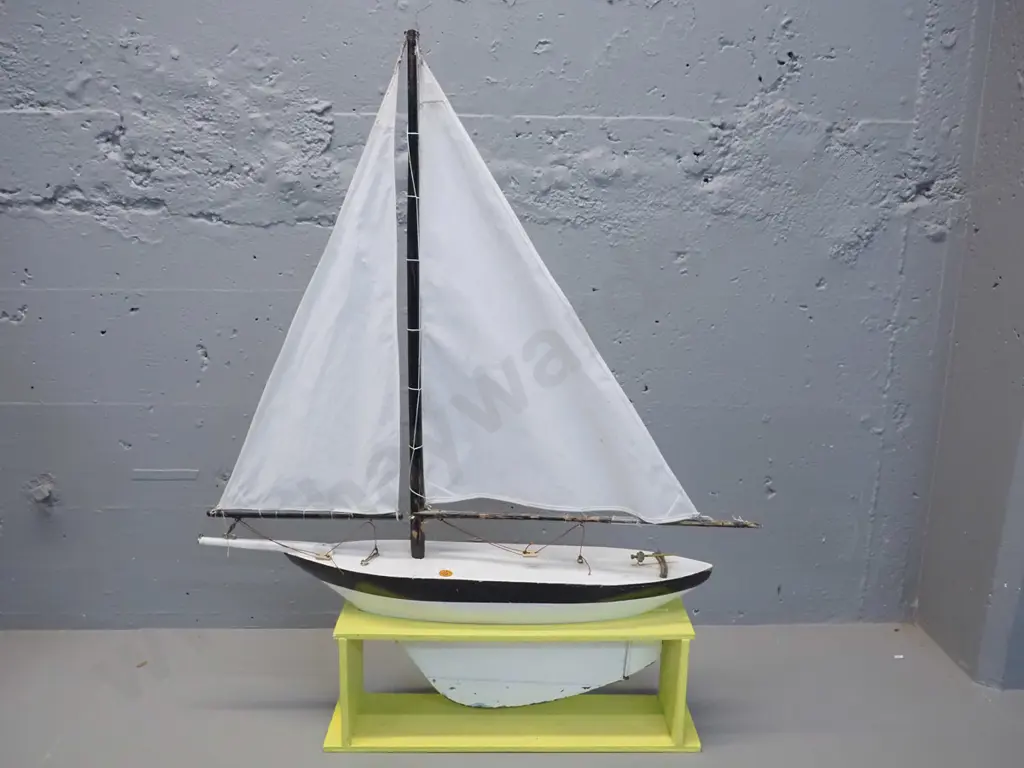 vintage pond yacht with sail and rigging, timber stand. Some wear and tear, a cut in one sail. L-550 H-700 in stand. Image 1++