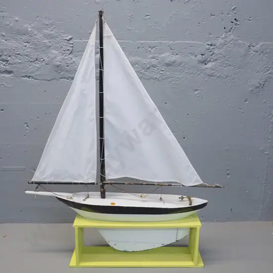 vintage pond yacht with sail and rigging, timber stand. Some wear and tear, a cut in one sail. L-550 H-700 in stand.