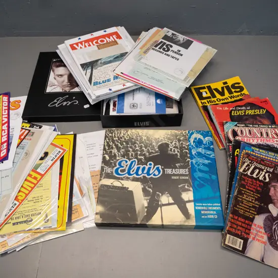 large quantity of facsimile Elvis Presley memorabilia with box, slip-cased Elvis Treasures book with CD and pull-out
