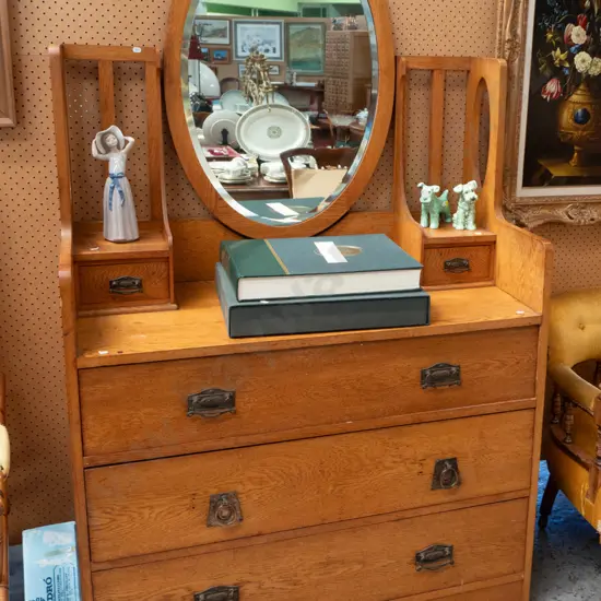 oak arts & crafts mirror-back dresser with oval bevelled mirror, 3 drawers in base, 2 small top drawers, mismatched drop