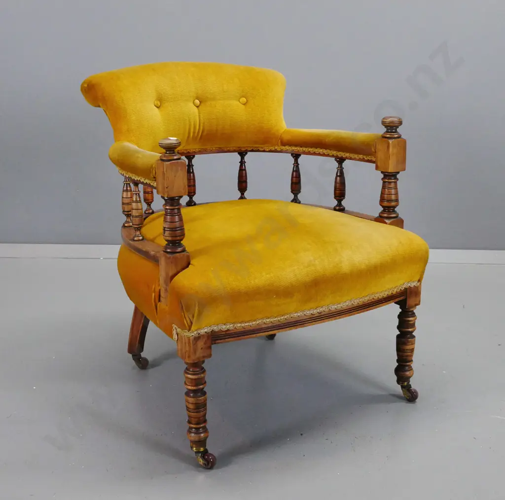 Edwardian beech tub chair with turned legs, uprights and spindle back, on porcelain casters, upholstered in button back Image 1++